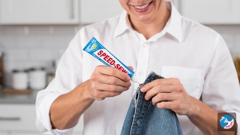 A person wearing a blue cotton shirt with a perfectly repaired side seam, demonstrating how to fix a ripped seam without sewing.